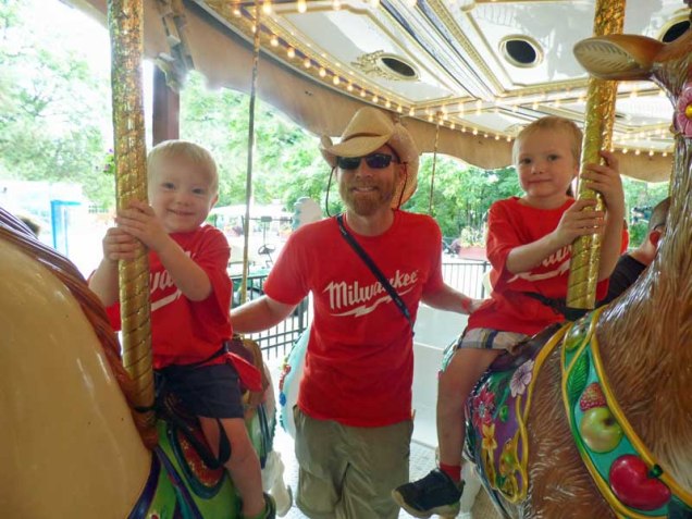 b Cam, George, Owen on Carousel